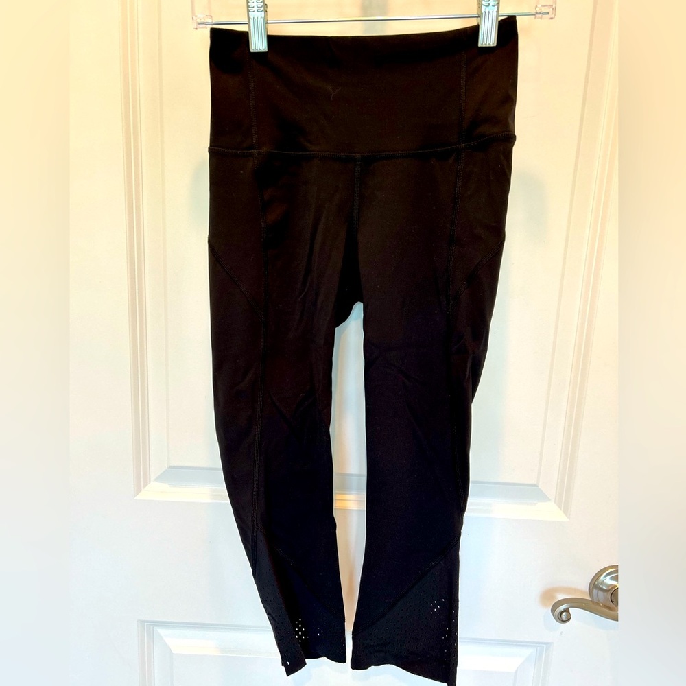 Lululemon cropped black leggings with cut out detail at ankle